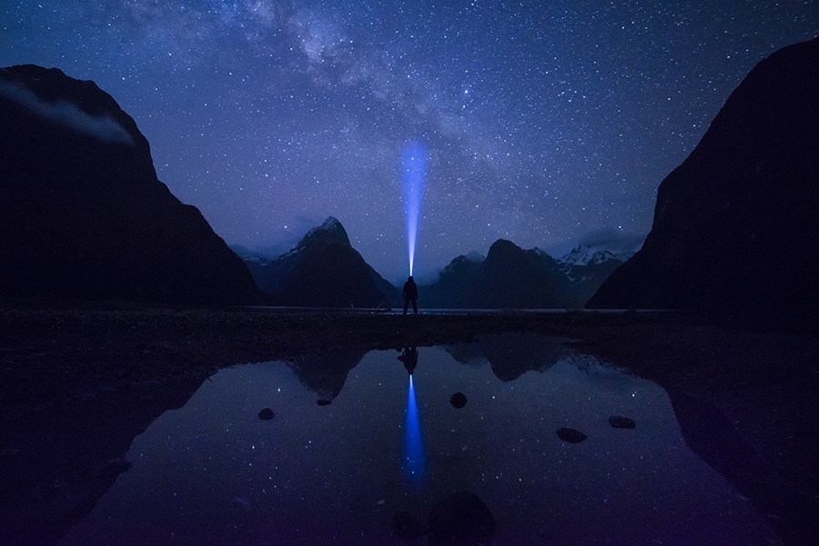 A man standing under a starry sky 