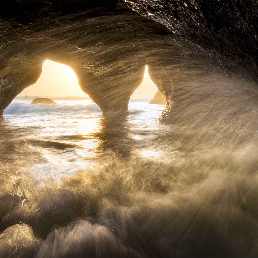 Waves crashing inside a sea cave