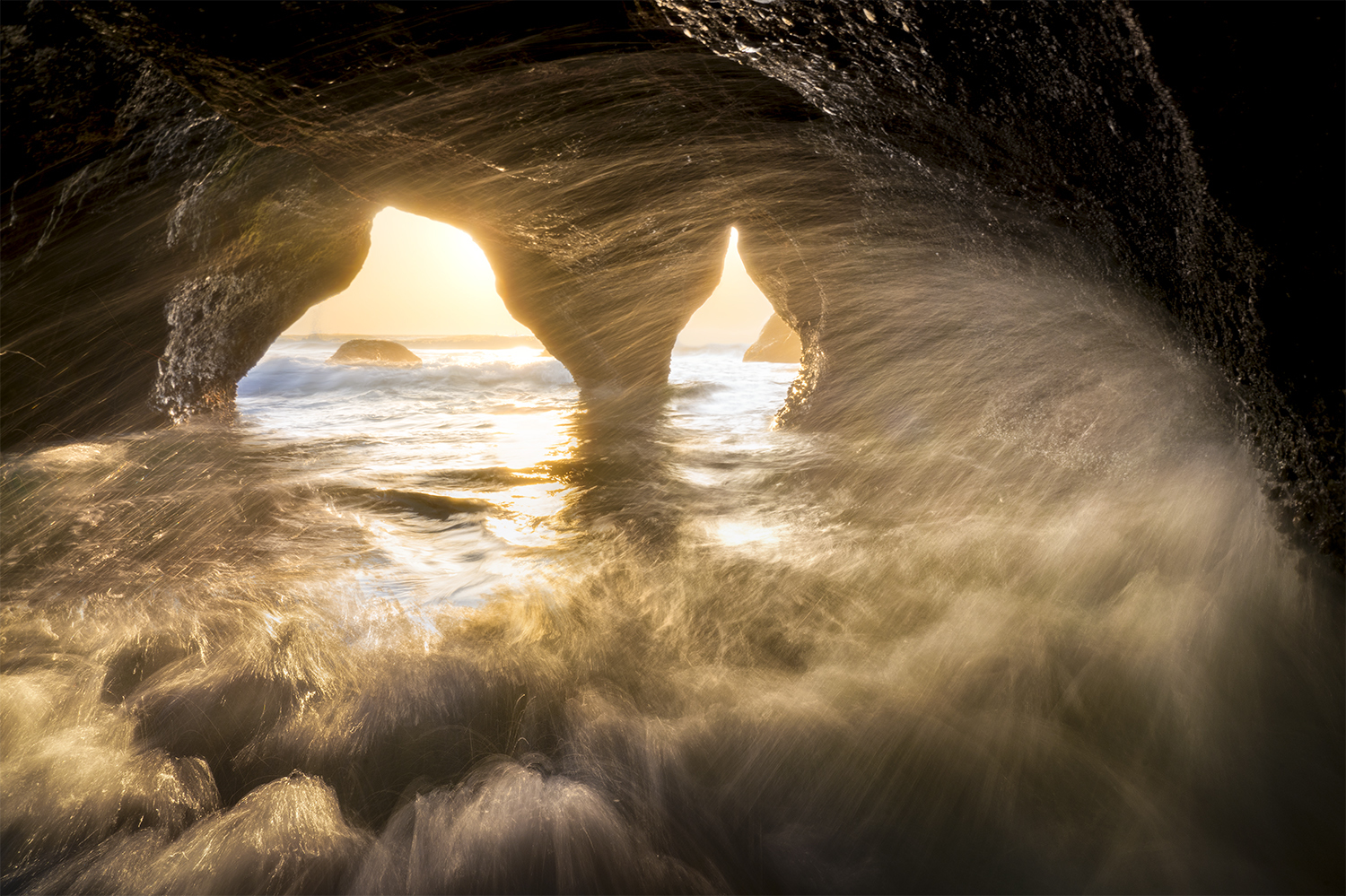 Waves crashing inside a sea cave