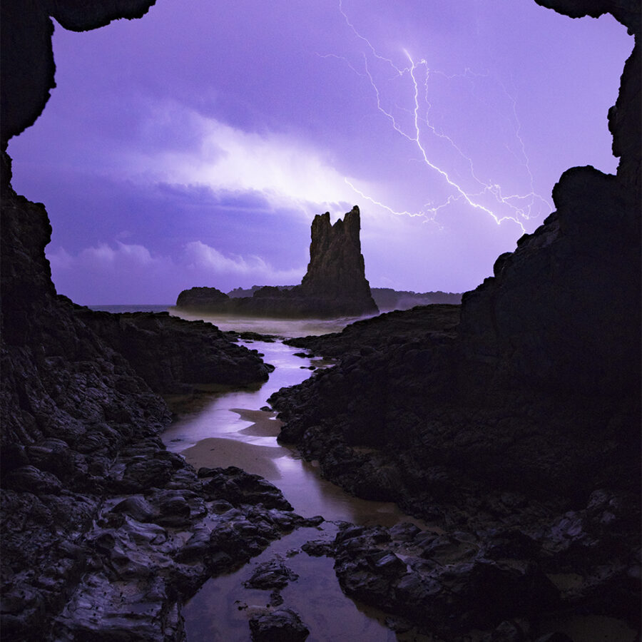Lightning storm sea cave