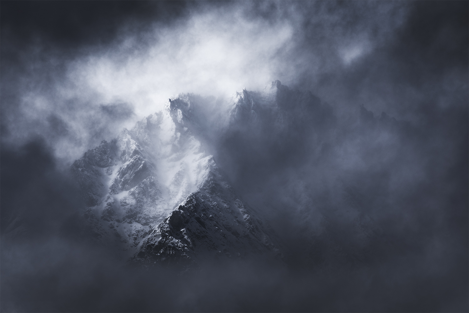 Mountain emerging from cloud