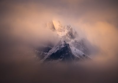 Mountain peeking through the cloud, New Zealand