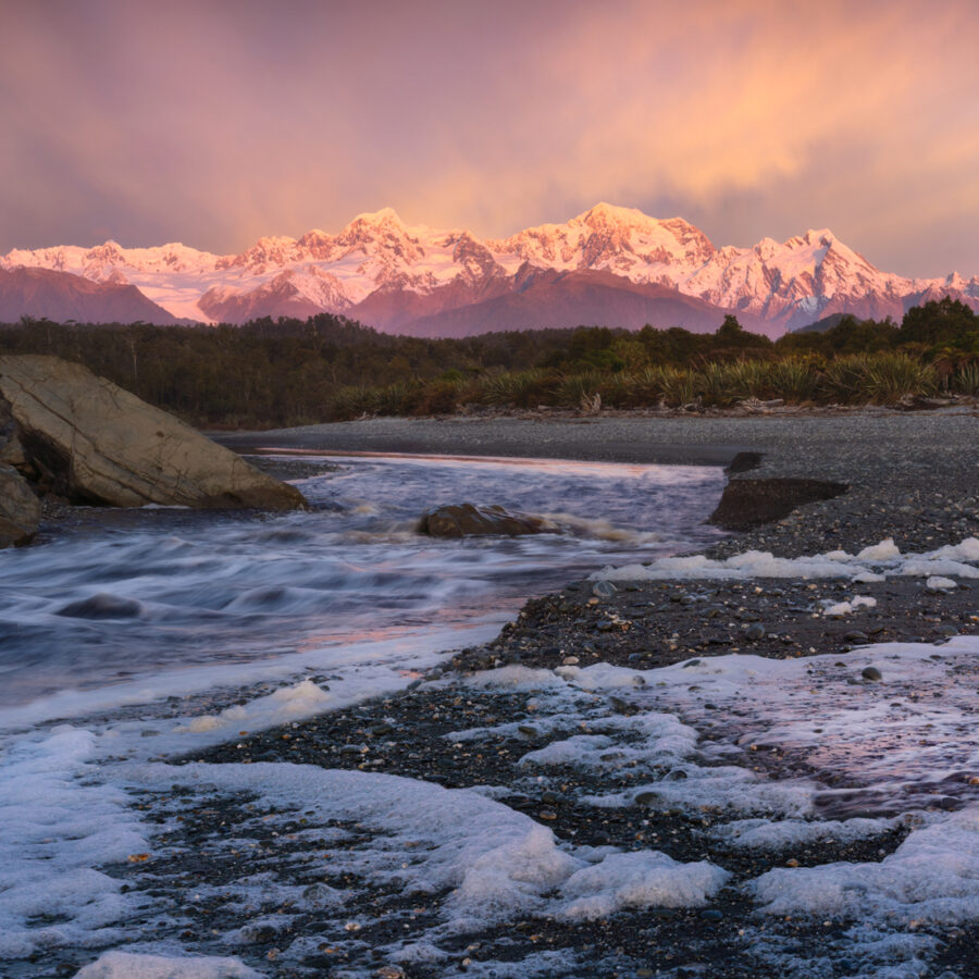Beach and Southern Alps sunset, New Zealand. Photography by William Patino.