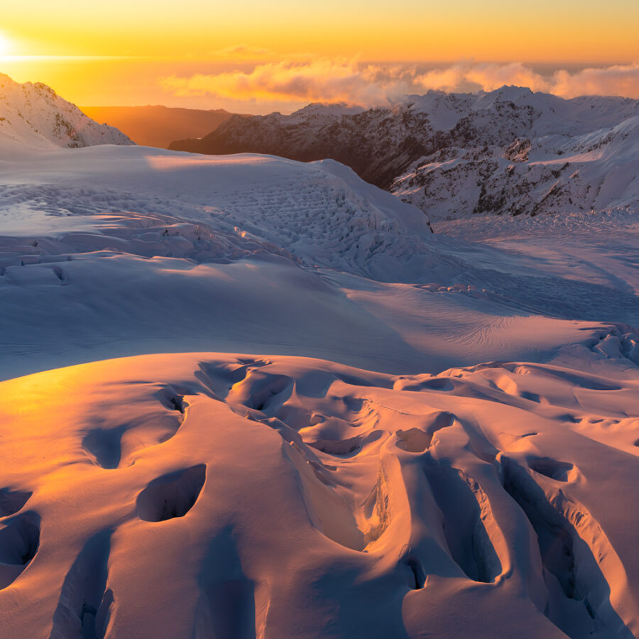 Sunset across an ice-field and glaciers in New Zealand